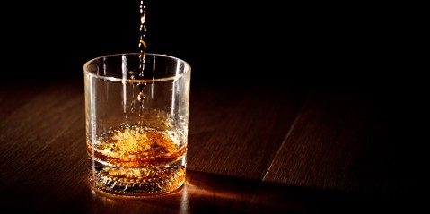 Whiskey being poured into a glass